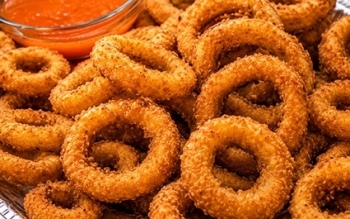 tray full of golden onion rings